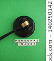 Gavel and personal injury words symbolizing legal proceedings and compensation claims 140250142