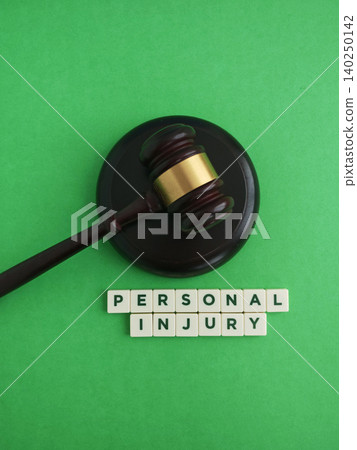 Gavel and personal injury words symbolizing legal proceedings and compensation claims Gavel and personal injury words symbolizing legal proceedings and compensation claims 140250142