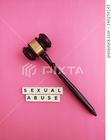 Gavel and sexual abuse words on pink background Gavel and sexual abuse words on pink background 140250143
