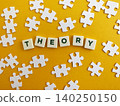 Theory word with puzzle pieces on yellow background 140250150