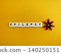 Epilepsy word spelling out with medicine capsules 140250151