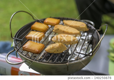 Making smoked cheese and smoked chicken while camping. Making smoked cheese and smoked chicken while camping. 140250878