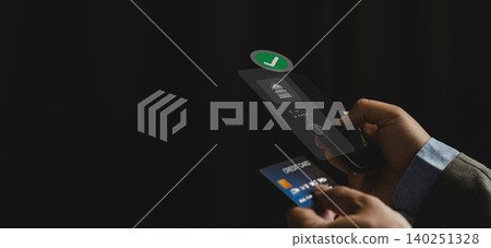 Person using smartphone and holding credit card with online banking transfer interface for digital payment, internet banking, secure transaction, and mobile finance workflow. Person using smartphone and holding credit card with online banking transfer interface for digital payment, internet banking, secure transaction, and mobile finance workflow. 140251328