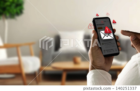 Person holding smartphone with spam warning icons and fake message alert interface, representing SMS phishing attack, mobile scam risk, online fraud prevention, and cyber security protection. 140251337