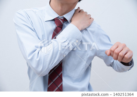 A businessman with a sore shoulder A businessman with a sore shoulder 140251364