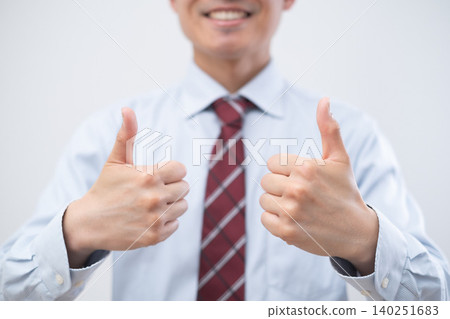 Businessman making a good sign with both hands Businessman making a good sign with both hands 140251683
