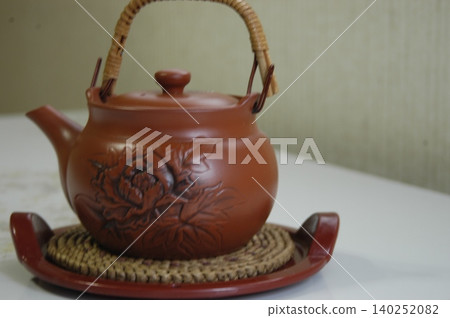 Tea in a teapot Tea in a teapot 140252082