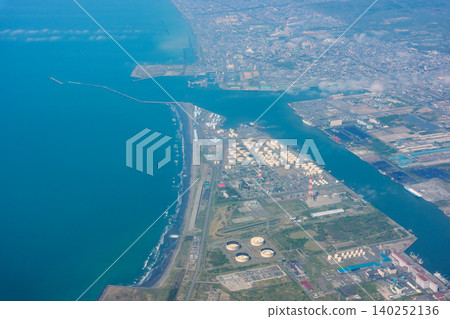Aerial view of Tomakomai Port from an airplane, showing Hokkaido's industrial zone and coastline. Aerial view of Tomakomai Port from an airplane, showing Hokkaido's industrial zone and coastline. 140252136