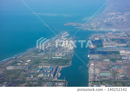 Aerial view of Tomakomai Port from an airplane, showing Hokkaido's industrial zone and coastline. Aerial view of Tomakomai Port from an airplane, showing Hokkaido's industrial zone and coastline. 140252142