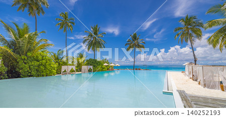 Infinity pool melting seamlessly into the turquoise Maldives lagoon. Palm trees mirrored on the still water surface. Luxury resort poolside where ocean and pool become one. Breathtaking tropical Infinity pool melting seamlessly into the turquoise Maldives lagoon. Palm trees mirrored on the still water surface. Luxury resort poolside where ocean and pool become one. Breathtaking tropical 140252193