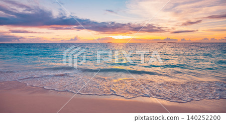 Soft golden sunset spilling warm light across gentle lapping waves. Tranquil tropical shore glowing in the fading evening. Peaceful seascape where calm water meets pastel sky. Dreamy beach escape Soft golden sunset spilling warm light across gentle lapping waves. Tranquil tropical shore glowing in the fading evening. Peaceful seascape where calm water meets pastel sky. Dreamy beach escape 140252200