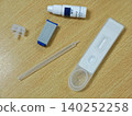 HIV Self Testing Kit on Wooden Surface test strip tube plastic medical device clinical home health neutral 140252258