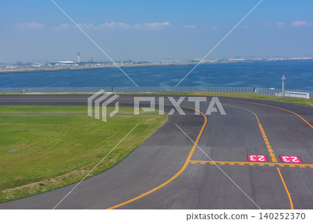 Haneda Airport runway, a view of Japan's largest airport overlooking Tokyo Bay. Haneda Airport runway, a view of Japan's largest airport overlooking Tokyo Bay. 140252370