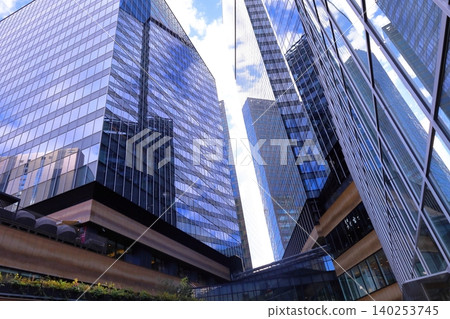 A photograph of the view looking up from in front of Osaka Station. 140253745