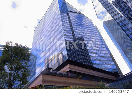 A photograph of the view looking up from in front of Osaka Station. A photograph of the view looking up from in front of Osaka Station. 140253747