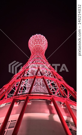 A night view looking up at the illuminated Kobe Port Tower from directly below. A night view looking up at the illuminated Kobe Port Tower from directly below. 140254832
