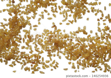 Bulgur wheat groats scattered top view flat lay Bulgur wheat groats scattered top view flat lay 140254936