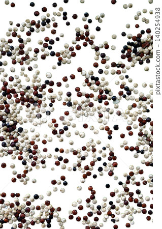 Scattered tricolor quinoa seeds macro texture 140254938