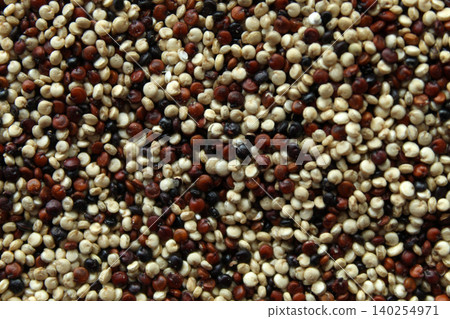 Mixed quinoa seeds macro texture top view tricolor Mixed quinoa seeds macro texture top view tricolor 140254971