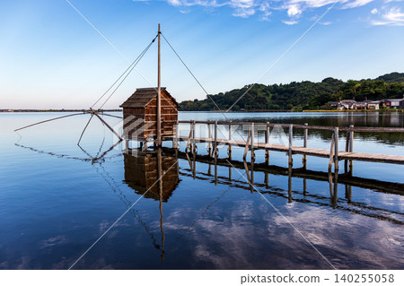 A tranquil morning view of the lake and sky. 140255058