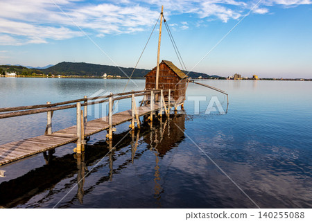 A tranquil morning view of the lake and sky. A tranquil morning view of the lake and sky. 140255088