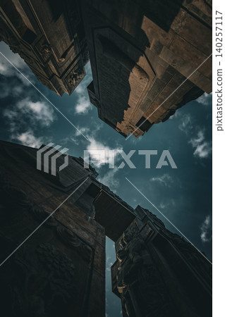 Dramatic Low Angle View of Monumental Stone Gateway with Historical Reliefs Dramatic Low Angle View of Monumental Stone Gateway with Historical Reliefs 140257117