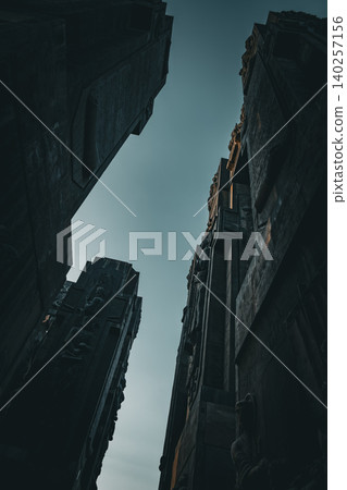 Dramatic Low Angle View of Monumental Stone Gateway with Historical Reliefs Dramatic Low Angle View of Monumental Stone Gateway with Historical Reliefs 140257156
