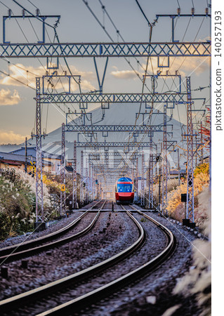 The Odakyu Romancecar Limited Express Hakone runs along the tracks with a view of Mount Fuji. The Odakyu Romancecar Limited Express Hakone runs along the tracks with a view of Mount Fuji. 140257193