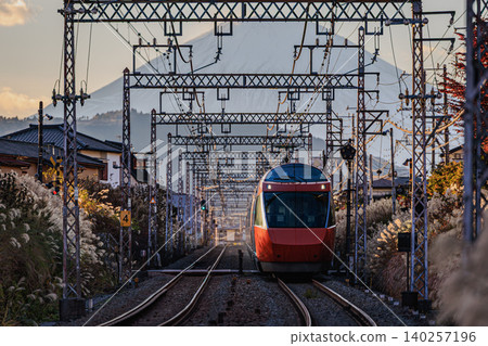 Odakyu Romancecar GSE (Limited Express Hakone) running with Mount Fuji in the background. 140257196