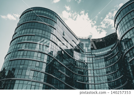 Modern Curved Glass Office Complex with Reflective Facade 140257353