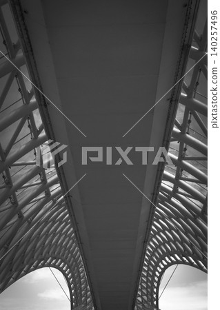 Modern Pedestrian Bridge with Futuristic Steel Structure and Glass Elements Modern Pedestrian Bridge with Futuristic Steel Structure and Glass Elements 140257496