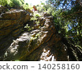 Akaiwa-ji Temple, Toyohashi City: A magnificent rock formation and a red temple hall. 140258160