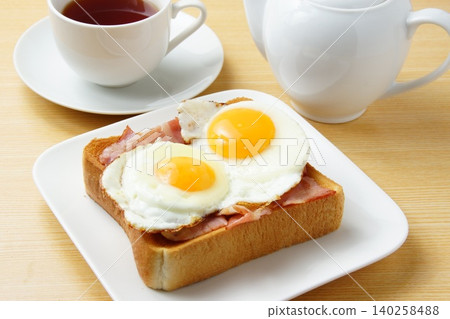 Bacon and fried egg toast Bacon and fried egg toast 140258488