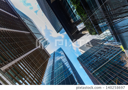 Landscape of the office town looking up at a skyscraper Landscape of the office town looking up at a skyscraper 140258697
