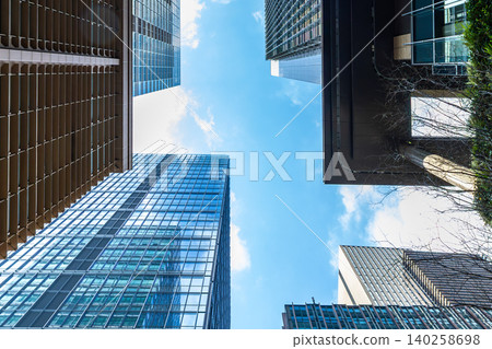 Landscape of the office town looking up at a skyscraper Landscape of the office town looking up at a skyscraper 140258698