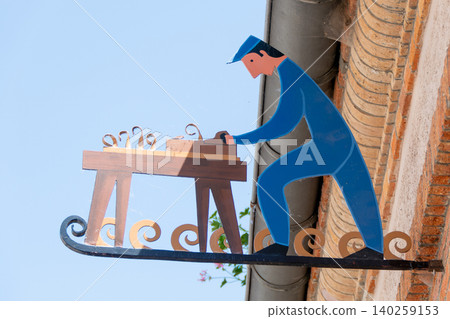 Wrought Iron Artisan Signboard on Building Wall in Hautvillers France Wrought Iron Artisan Signboard on Building Wall in Hautvillers France 140259153