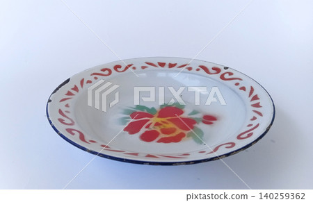 Top view of antique tin plates or enamel plates, traditional Indonesian tableware. Top view of antique tin plates or enamel plates, traditional Indonesian tableware. 140259362