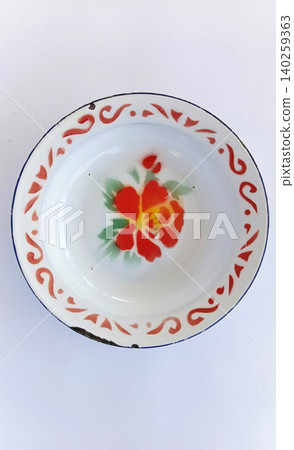 Top view of antique tin plates or enamel plates, traditional Indonesian tableware. Top view of antique tin plates or enamel plates, traditional Indonesian tableware. 140259363