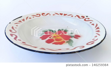 Top view of antique tin plates or enamel plates, traditional Indonesian tableware. Top view of antique tin plates or enamel plates, traditional Indonesian tableware. 140259364