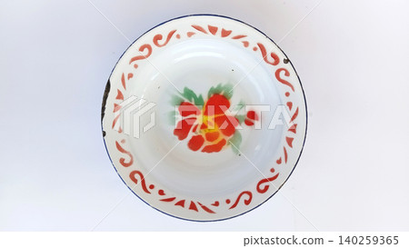Top view of antique tin plates or enamel plates, traditional Indonesian tableware. Top view of antique tin plates or enamel plates, traditional Indonesian tableware. 140259365