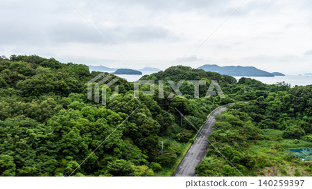 A lush summer landscape (aerial view) overlooking the verdant mountains and islands of the Seto Inland Sea. A lush summer landscape (aerial view) overlooking the verdant mountains and islands of the Seto Inland Sea. 140259397
