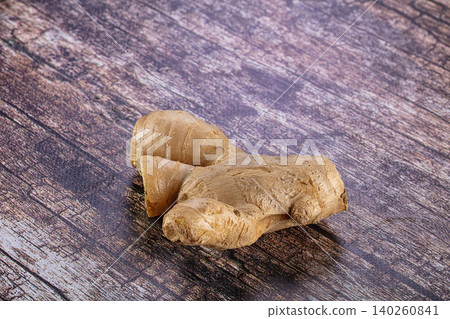 Fresh ginger root on rustic wooden table background Fresh ginger root on rustic wooden table background 140260841