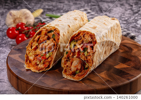 Chicken Shawarma Wraps Fresh Ingredients on Wooden Board Chicken Shawarma Wraps Fresh Ingredients on Wooden Board 140261000