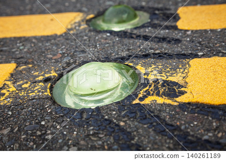 Low Green Road Studs On Weathered Pavement 140261189
