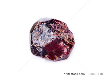 Macro of a mineral garnet stone on a white background Macro of a mineral garnet stone on a white background 140261489