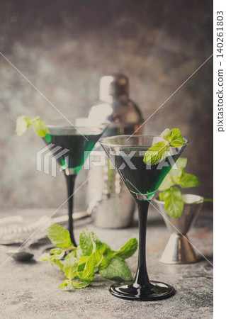 Green cocktails in martini glasses Green cocktails in martini glasses 140261803
