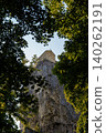 the Katskhi pillar is visible through the trees. A lonely monastery on the top of a high cliff 140262191