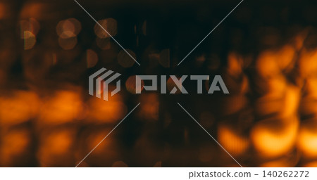 Bokeh effect. Blur light. Defocused golden neon color lens sparkle glare gleam optical shine glow on abstract art dark black background. Bokeh effect. Blur light. Defocused golden neon color lens sparkle glare gleam optical shine glow on abstract art dark black background. 140262272