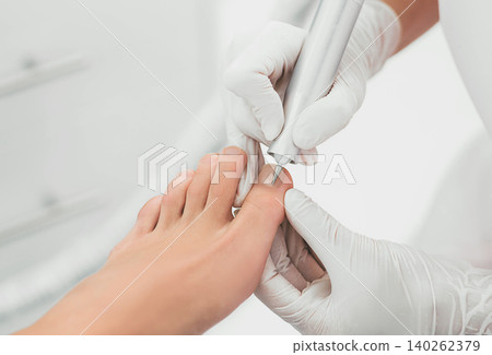 female legs close-up during a hardware manicure female legs close-up during a hardware manicure 140262379