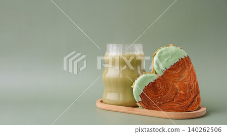 Drink beverage coffee cappuccino latte Delicious fresh croissant topped with Matcha Green Tea flavor Ganache. Creation unique heart shape bakery. Puff pastry holiday love gift present idea Valentine's 140262506